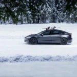 tesla model 3 highland us logo winter snow scaled 1