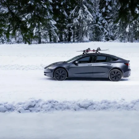 tesla model 3 highland us logo winter snow scaled 1
